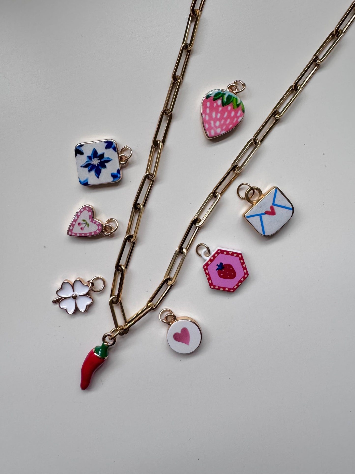 Gold tone link necklace with chilli charm