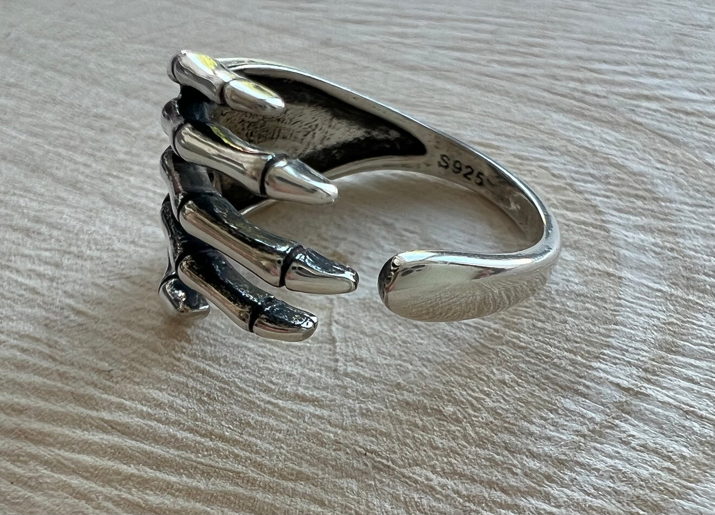 Silver skeleton hand ring