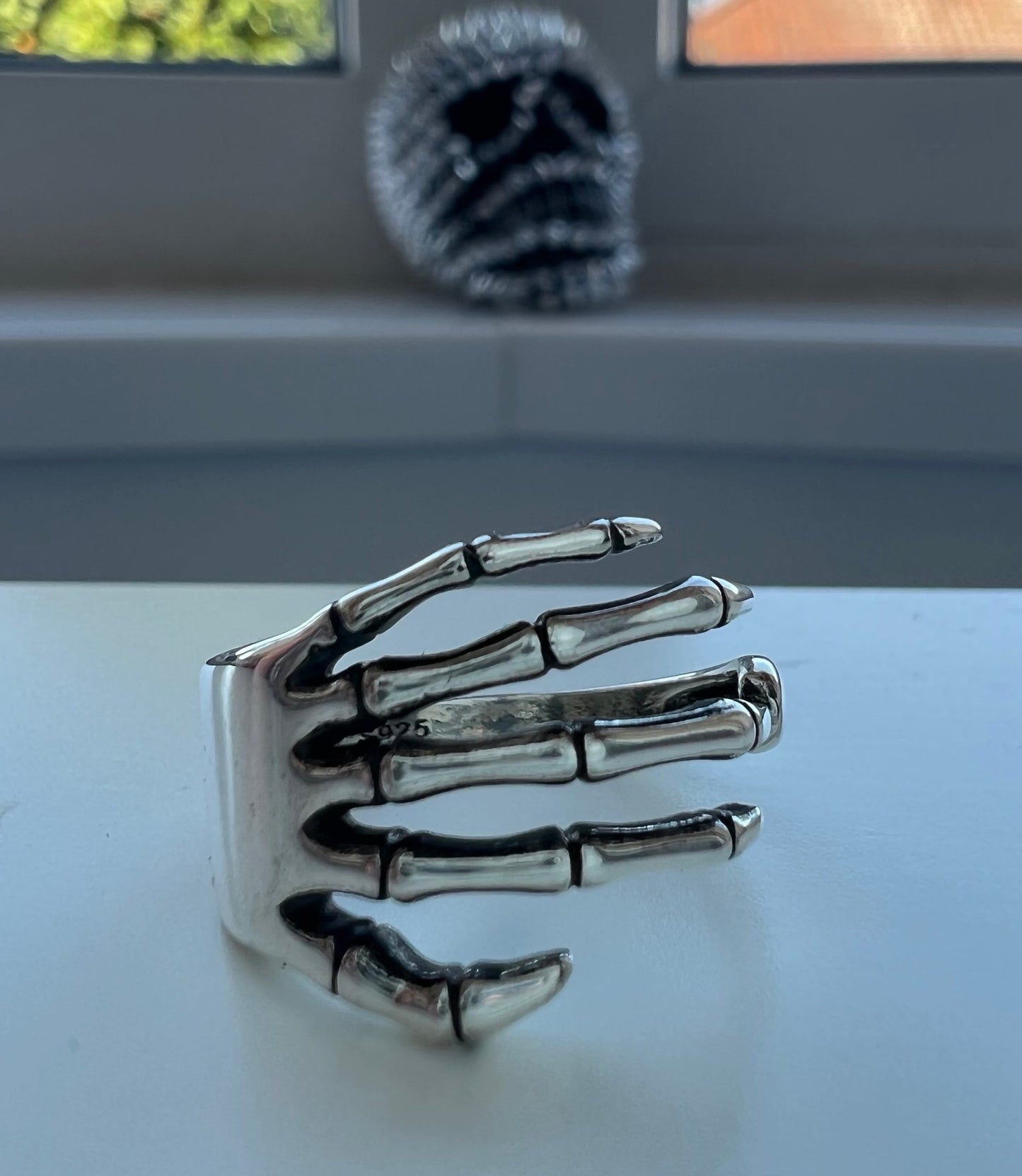 Silver skeleton hand ring